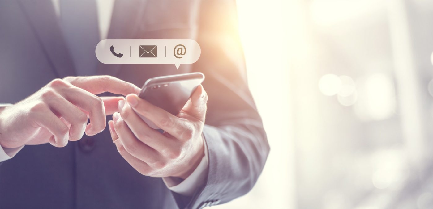 CONTACT US, Hand of Businessman holding mobile smartphone with ( mail,phone,email ) icon. customer support concept, copy space.
